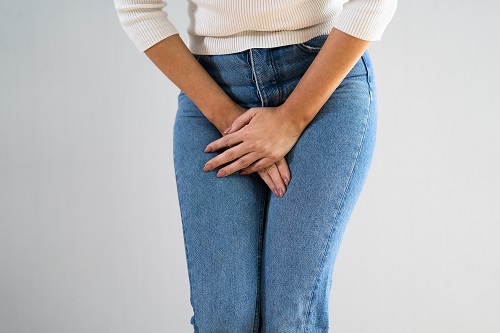 Bowel Incontinence Pain. Woman Hand Holding Crotch